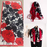Scarves with red, black, and white floral pattern on a white background