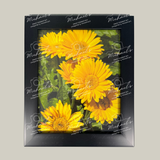Black matte framed picture of yellow flowers with 'Michaels' branding on a gray background