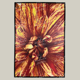 Large scale framed artwork with a close-up of a Dahlia in vibrant orange and red colours on a grey background.