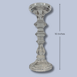 Clear glass candlestick on a light blue background with a measurement label indicating 10 inches.