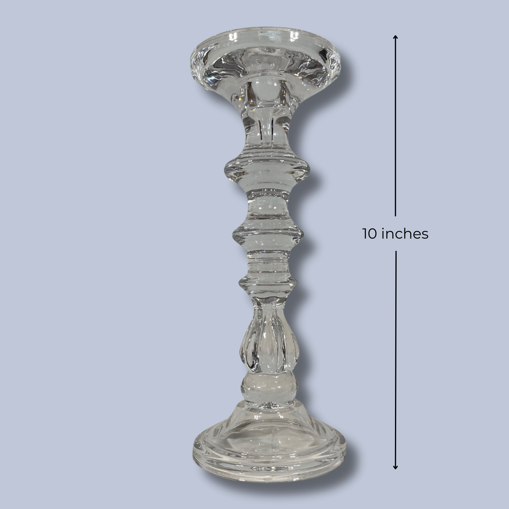 Clear glass candlestick on a light blue background with a measurement label indicating 10 inches.