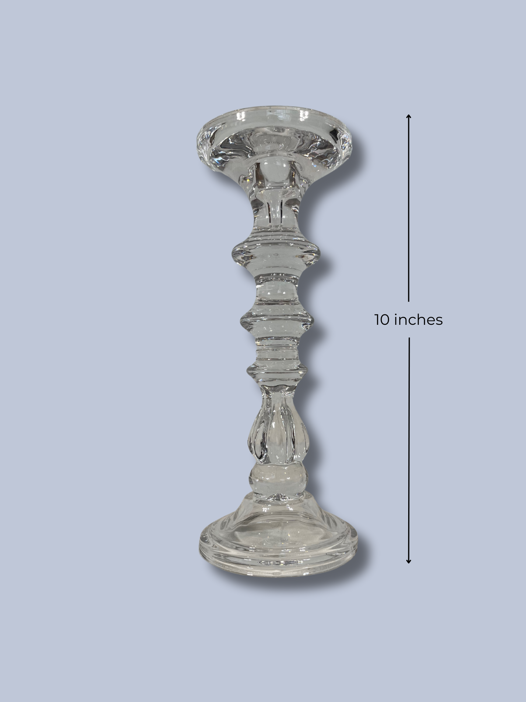 Clear glass candlestick on a light blue background with a measurement label indicating 10 inches.