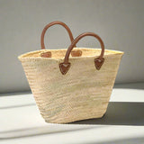 Rustic yet elegant handwoven basket, embodying traditional French charm. Perfect for carrying your market treasures with ease; the sturdy yet supple leather handles provide both durability and a touch of effortless style.