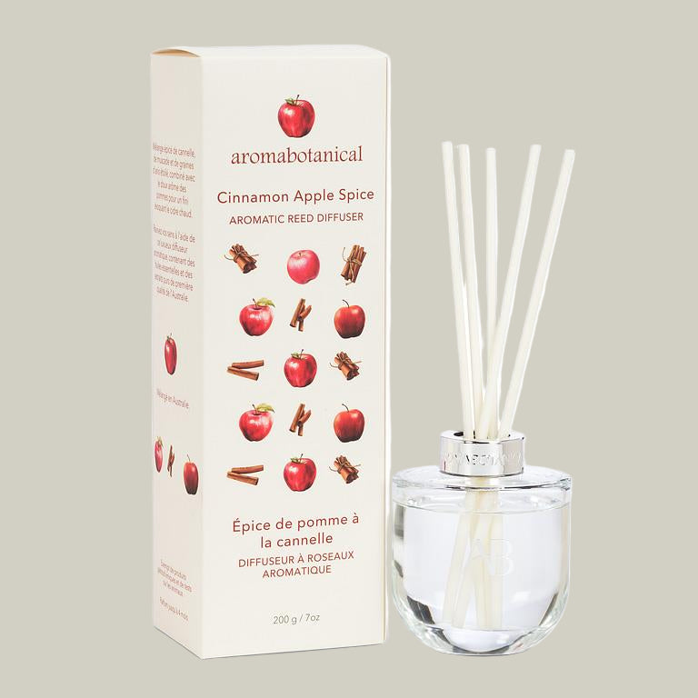 Aromabotanical Cinnamon Apple Spice reed diffuser with packaging on a white background