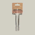 Copper plant markers on a beige background