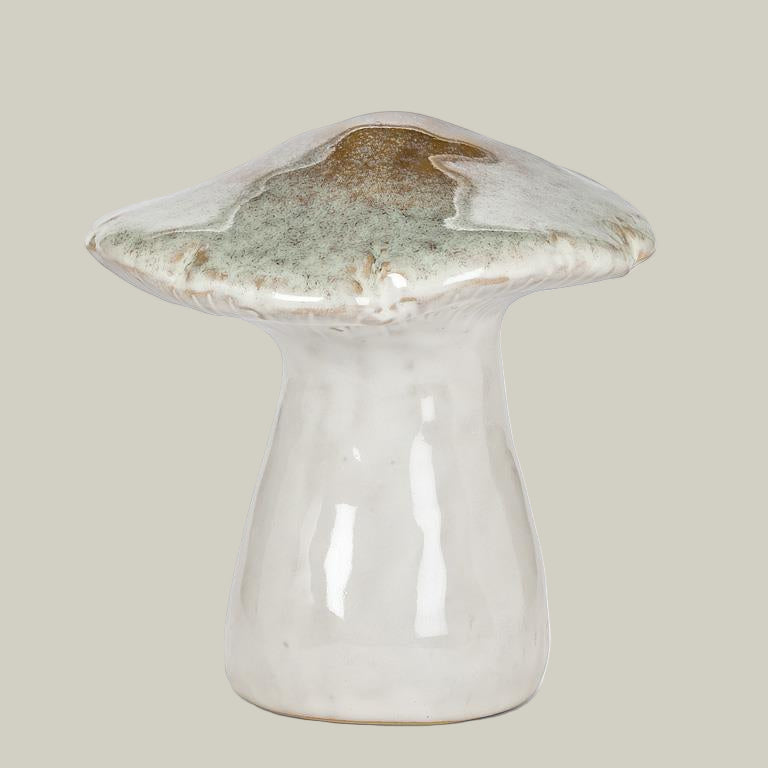 Ceramic mushroom sculpture with a greenish-brown cap on a pale green background