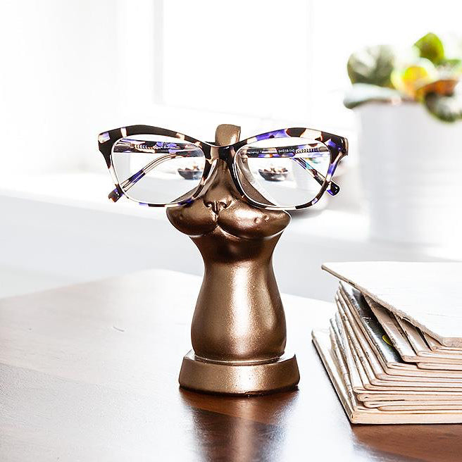 Bronze coloured eye glass holder that is shaped like the lower portion of a cat's face.