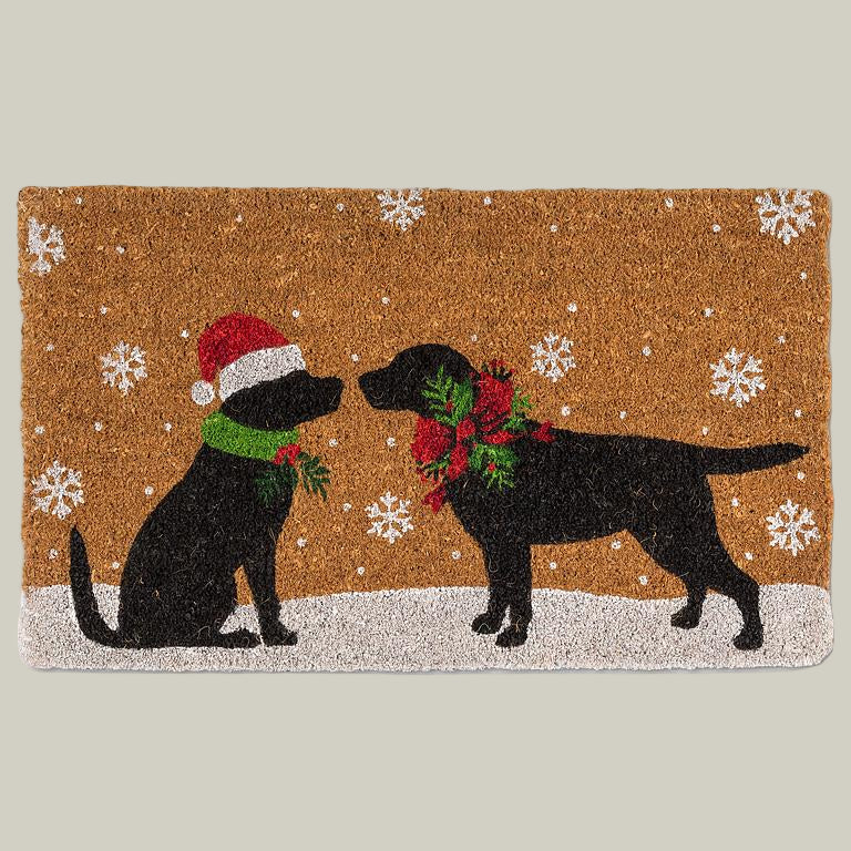 Doormat with two black dogs rubbing noses, wearing Christmas attire.