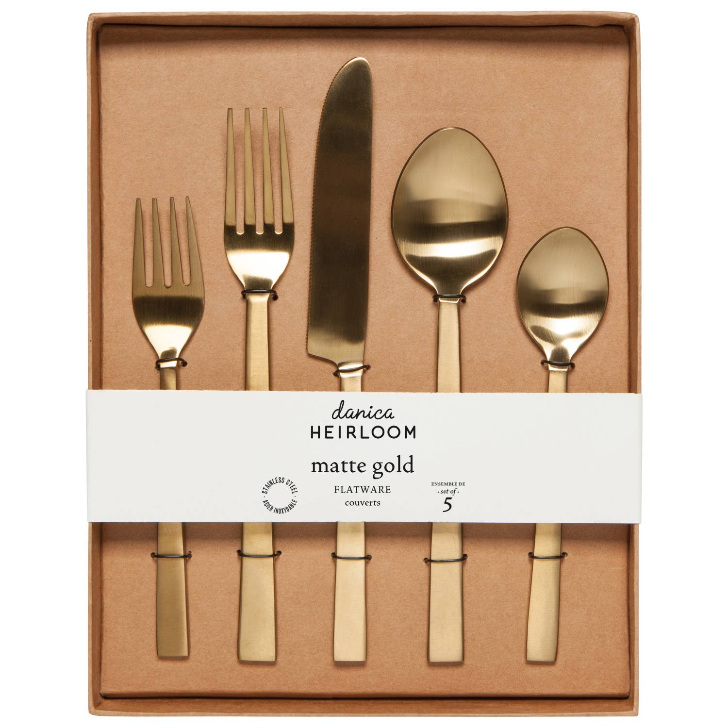 Gold plated stainless steel flatware set with in it's packaging, a tan coloured box with a white band