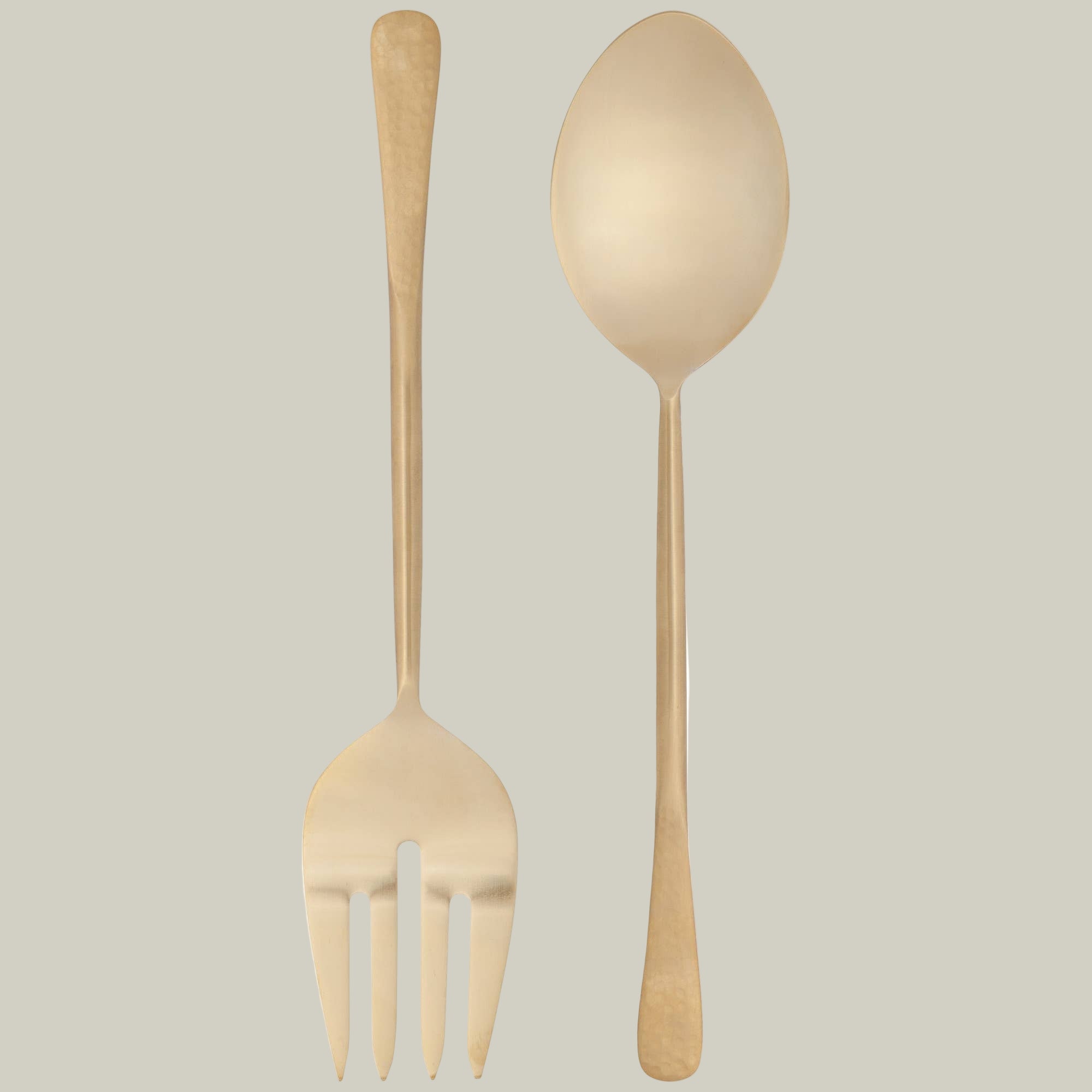 Gold plated stainless steel serving set featuring a large fork and spoon. 