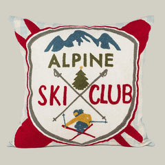 Decorative pillow with 'Alpine Ski Club' design featuring mountains, skiers, and trees.