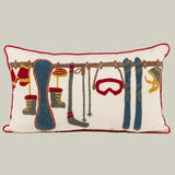 Decorative pillow with skiing-themed illustrations on a white background