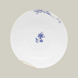 Top view of porcelain bowl from Pip Studio Royal White collection with blue floral design and gold accents.