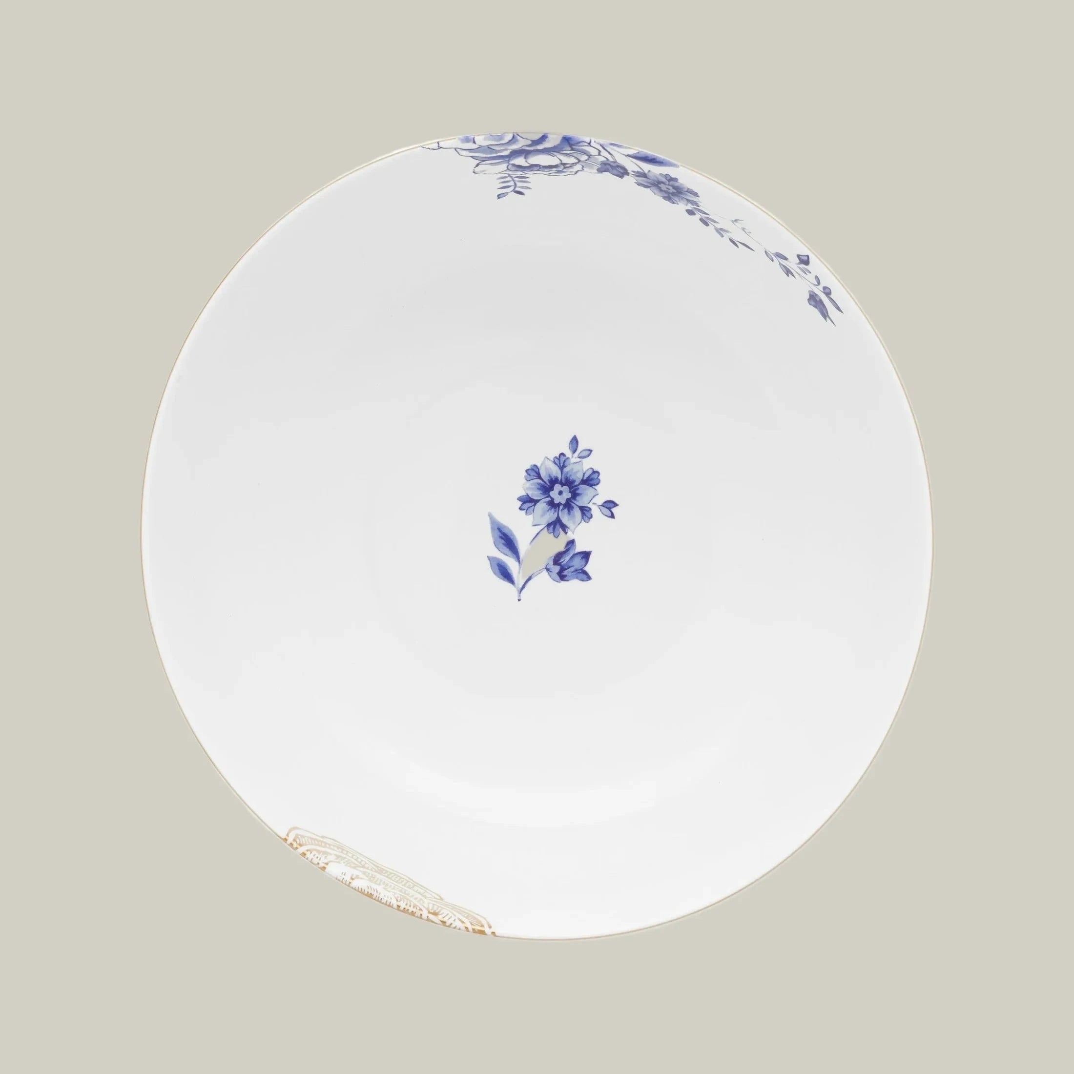 Top view of porcelain bowl from Pip Studio Royal White collection with blue floral design and gold accents.