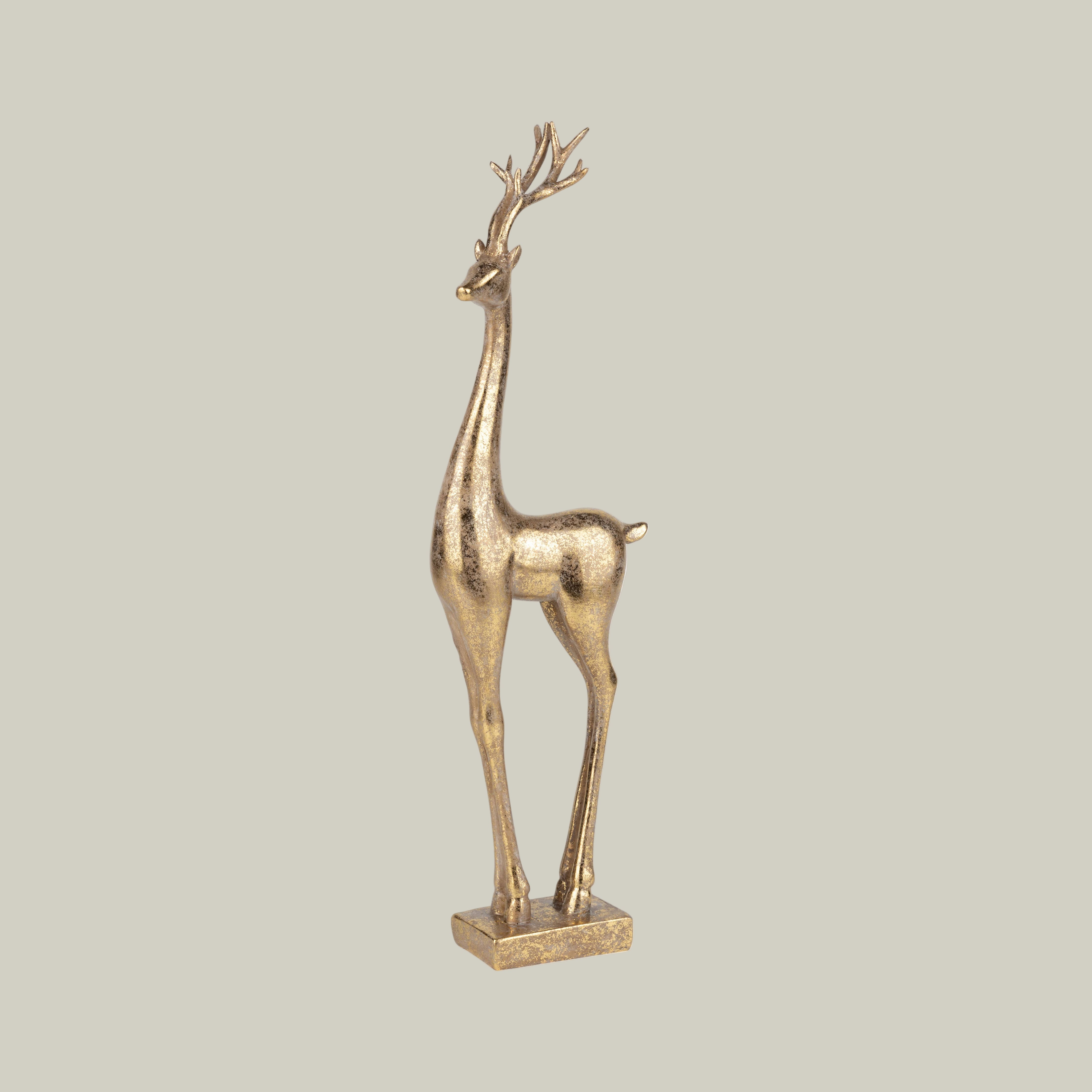 Gold deer figurine on a white background