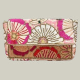 Decorative clutch bag with floral patterns on a light purple background