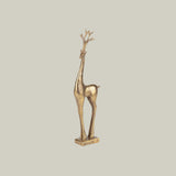 Gold deer figurine on a white background