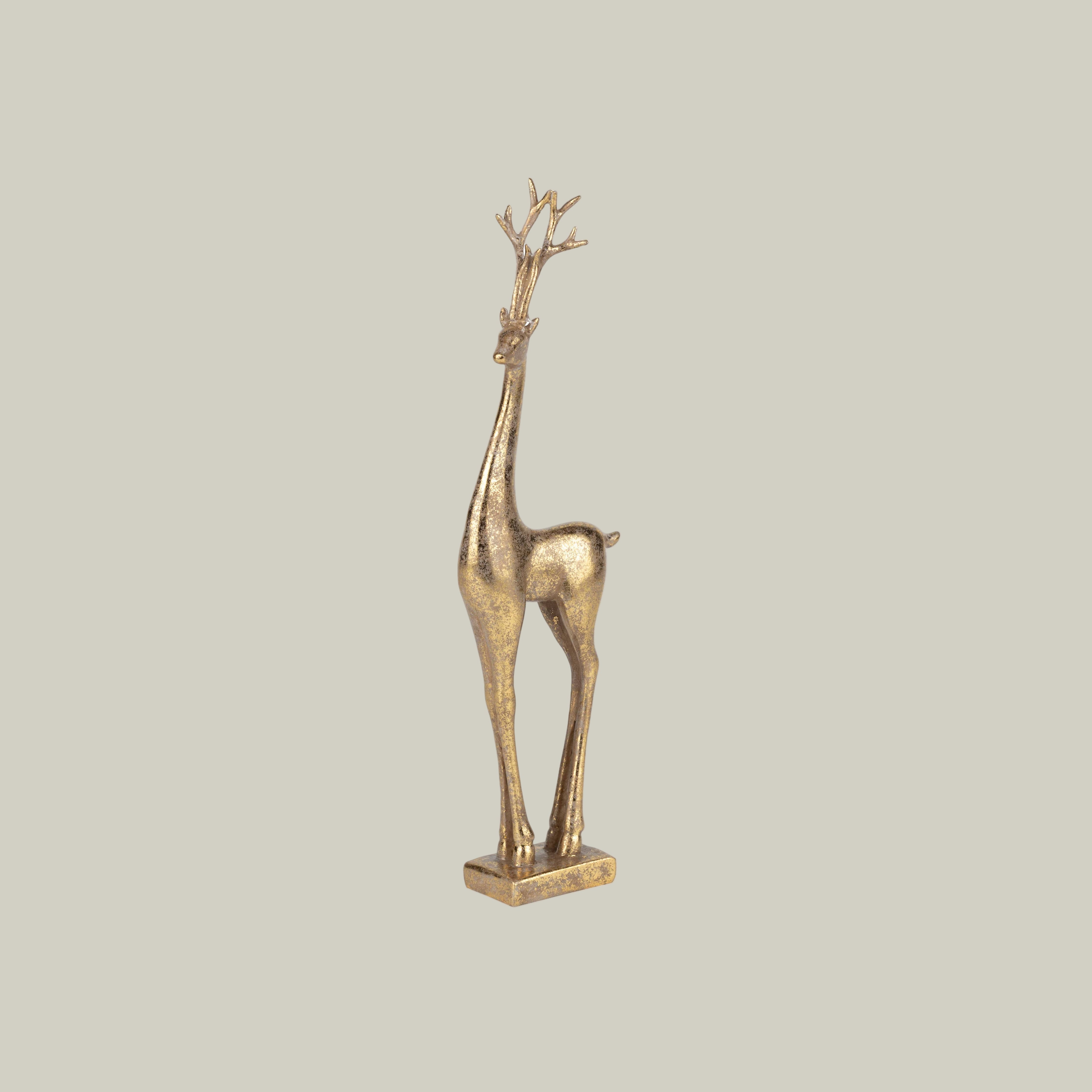 Gold deer figurine on a white background