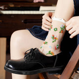 Person wearing sheer floral socks with ruffle top and black Oxford shoes. 