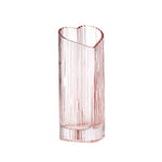 Blush heart shaped glass vase on a white background.