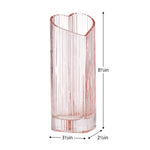 Blush coloured heart shaped glass vase on a white background with dimensions 8.5 inches tall, 2.5 inches wide, 3.5 inches deep.