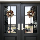 Black double doors with glass panels featuring two meticulously crafted 10-inch accent wreath with it's lush burgundy red teasels providing a striking focal point against the delicate, ethereal sprays of Bupleurum in a soft pink and natural willow eucalyptus adds a graceful touch of olive green.
