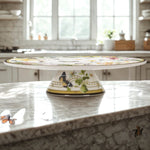 Decorative cake stand with butterfly design on a kitchen counter