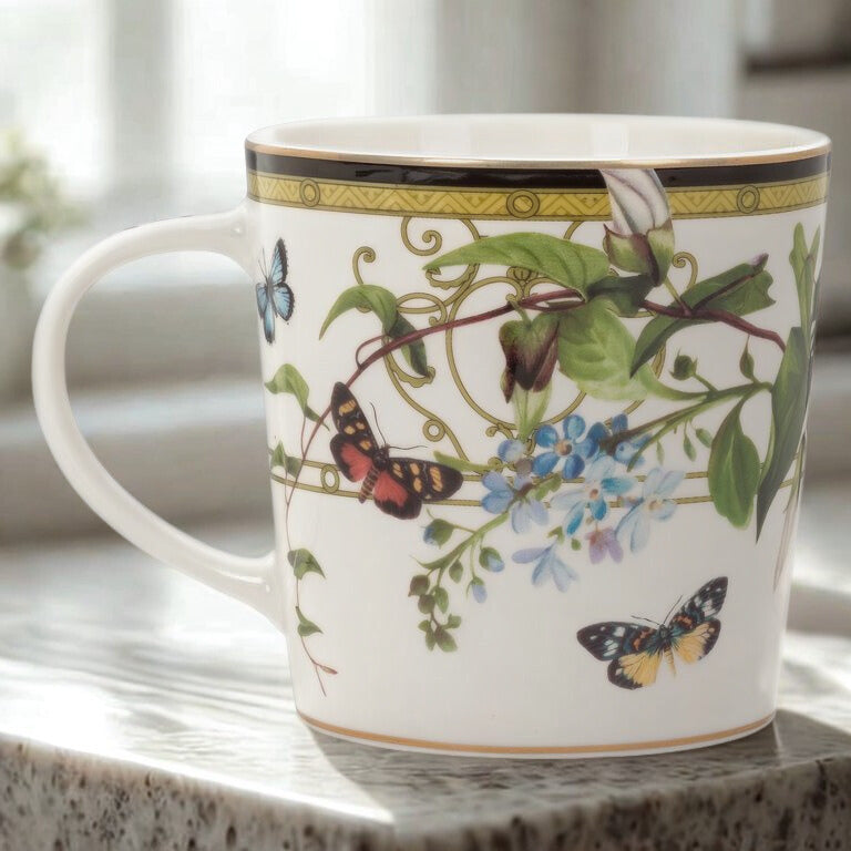Decorative mug with butterfly and floral design on a surface