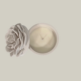 Ceramic container with candle and a rose design on the lid