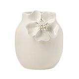 White ceramic vase with crackle glaze and a floral appliqué on a white background
