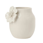 White ceramic vase with crackle glaze and a floral appliqué on a white background