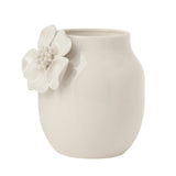 White ceramic vase with crackle glaze and a floral appliqué on a white background