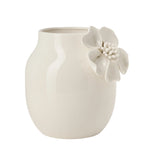 White ceramic vase with crackle glaze and a floral appliqué on a white background