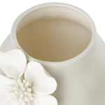 Close-up of the opening of a white ceramic vase with crackle glaze and a floral appliqué on a white background