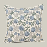 Floral patterned pillow with blue flowers on a ivory background