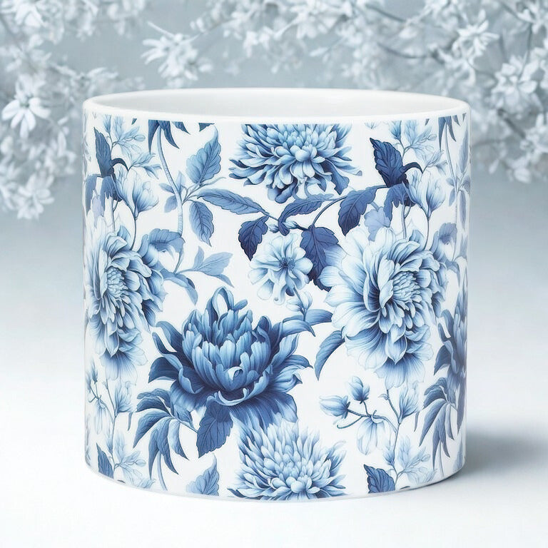 Ceramic planter with blue floral design on a light background