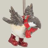 Decorative winter chickadee ornament wearing a red scarf and boots on a pale green background