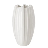 A white ceramic vase with a fluted, ribbed texture and a scalloped rim, shown against a plain white background.