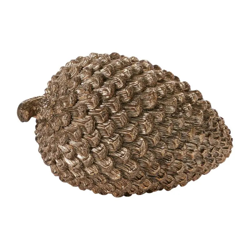 Bronze pine cone-shaped decorative object on a white background