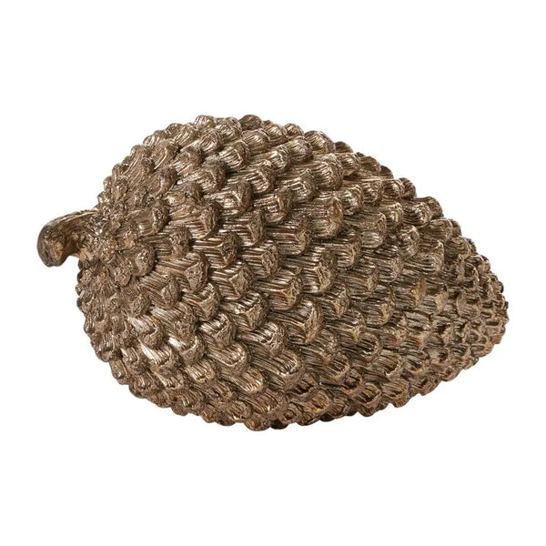 Bronze pine cone-shaped decorative object on a white background