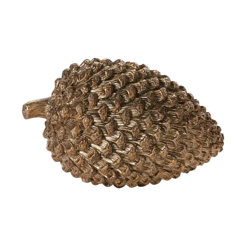 Bronze pine cone decorative object on a white background