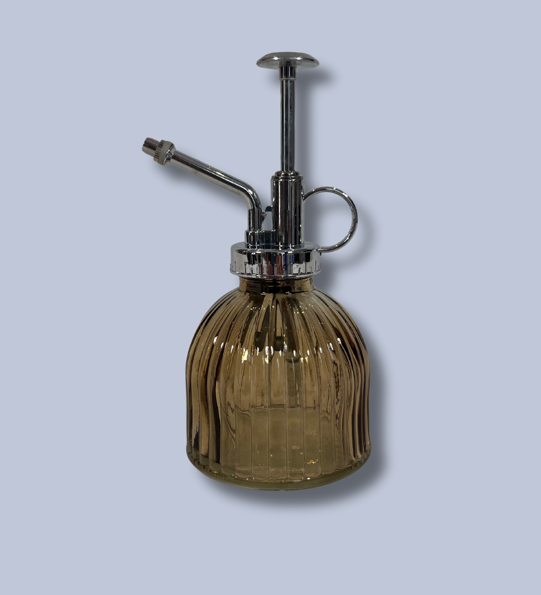 Vintage-style glass spray bottle with ribbed design on a light gray background