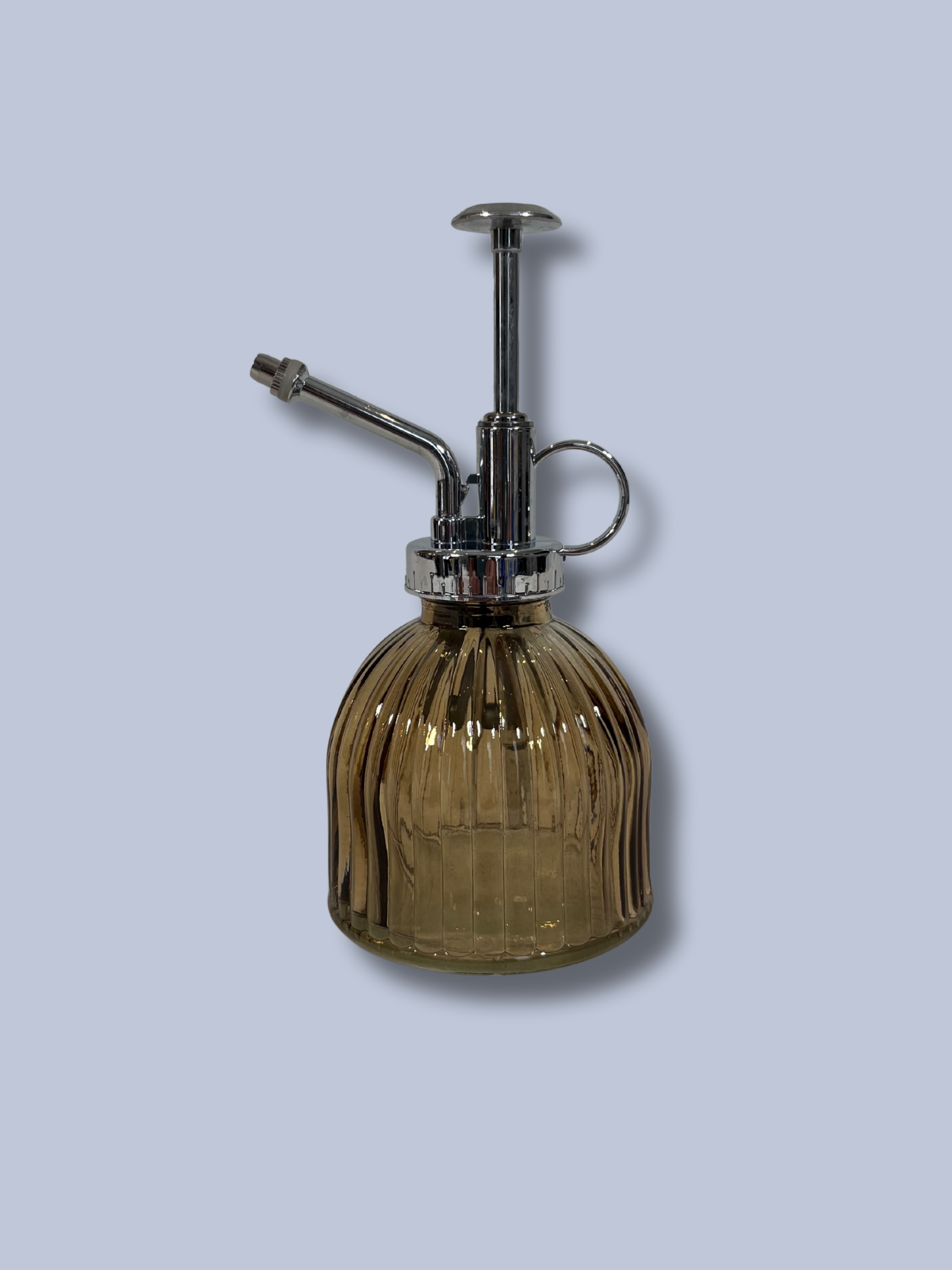 Vintage-style glass spray bottle with ribbed design on a light gray background