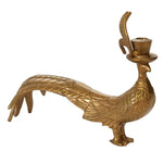 Gold peacock-shaped candle holder on a white background