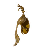 Decorative brass peacock wall sculpture on a white background