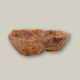 Beautiful hand carved Forest Legacy Bowl made from a fir stump left over from logging industry with a grey background