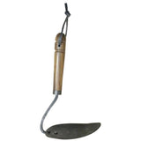 Hand-held gardening hoe with wooden handle with leather hanging strap and forged iron blade on a white background