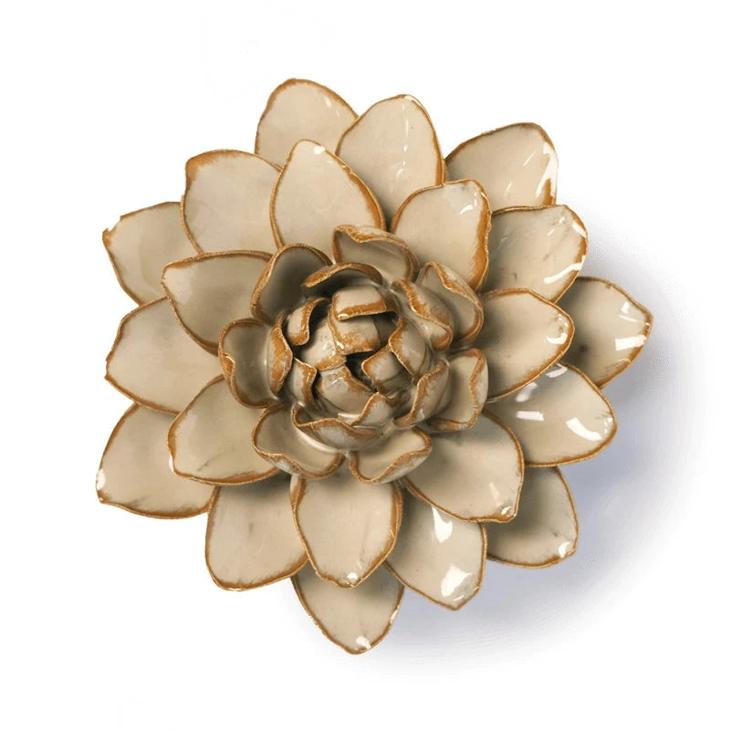 A ceramic Dahlia sculpture with layered beige petals outlined in an earthy brown, set against a plain white background.