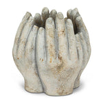 Concrete vase carved into four hands in a circle on a white background. 2