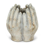 Concrete vase carved into four hands in a circle on a white background. 3